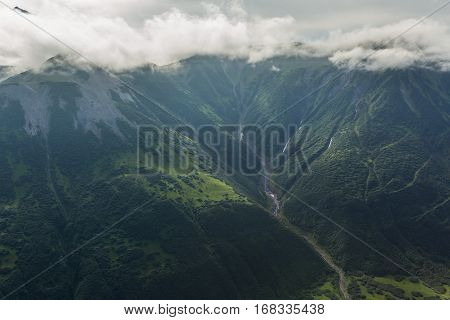 Glacial river between the hills. South Kamchatka Nature Park. View from the helicopter.