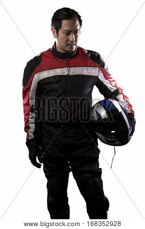 Man wearing a protective leather and textile racing suit for race cars and motorcycle motor sports. The gear is armored with a helmet and worn by bikers and professional drivers. The man is isolated on a white background.
