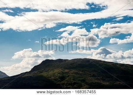 Green hill under a blue cloudy sky in Subic bay philippines