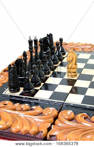 The chess pieces are placed on the chessboard. Defeated black king. The player admitted defeat