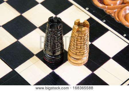 The chess pieces are placed on the chessboard. Defeated black king. The player admitted defeat