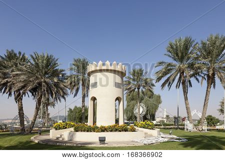 MEZAIRAA, UAE - DEC 4, 2016: Replica of a traditional arabian tower in a roundabout in Mezairaa. Liwa Oasis area Emirate of Abu Dhabi United Arab Emirates