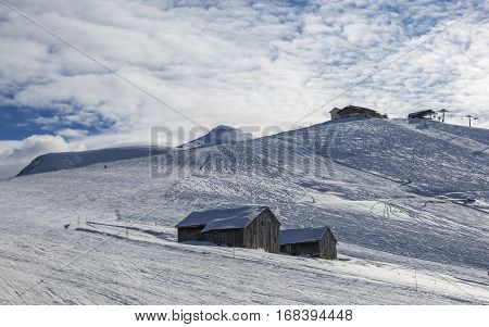 Empty ski domain located at high altitude in Alps in Beaufortain Massif in Haute-Savoie close to Mont Blanc. In the distance can be seen Mont Joly peak at 2525 m .