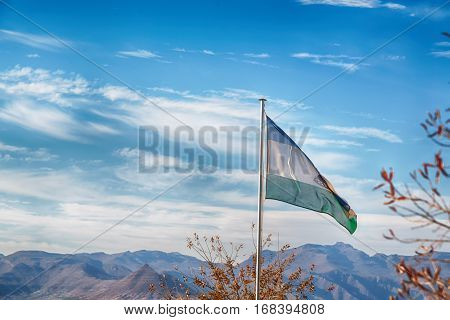 In The Cloudy Sky Waving Flag