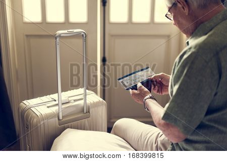 Senior Man Hands Hold Plan Ticket Luggage