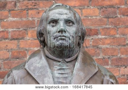 Copenhagen, Denmark, January 21, 2017: Bronze statue of the reformer Martin Luther in front of Luther church. On October 31, 2017, it marks the 500 anniversary of that he nailed his 95 theses.