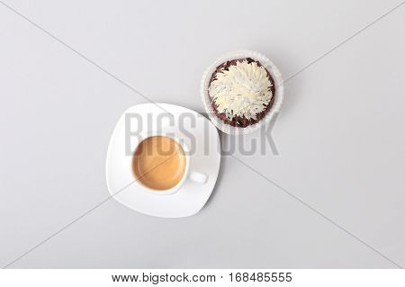 Classic style espresso shot with chip muffin and coffee beans on white background