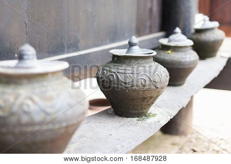 Earthenware ,Old handmade Pottery on the wood