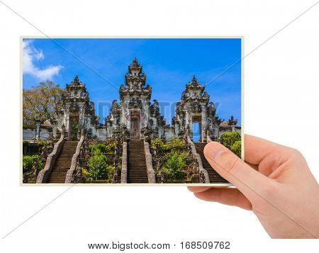 Hand and Lempuyang temple in Bali Indonesia (my photo) isolated on white background