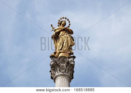 MARIBOR, SLOVENIA - APRIL 03: Virgin Mary statue, Plague column at Main Square of the city of Maribor in Slovenia, Europe. Historical religious sculpture, April 03, 2016.