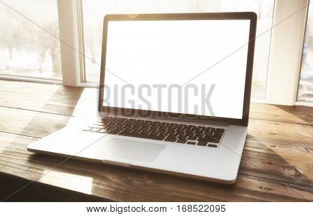 One modern laptop on hte window-sill
