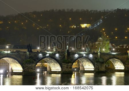 Panorama of an old Prague, bridges and embankment of Vitava river, Czechia in a night