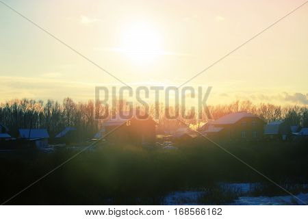beautiful winter landscape. cottages in a sunlight