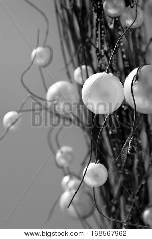 Balls of plastic emulating to fruits in branches of wood