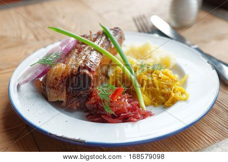 Grilled pork ribs with sauerkraut and potato puree  - hearty dish