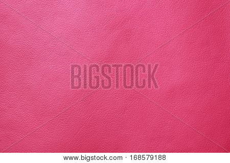 Pink leather texture closeup background. Structured background design nubuk