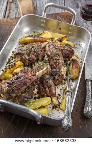 Lamb Knuckle with Fried Potatoes in Roasting Dish