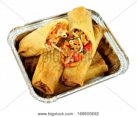 Chinese crispy vegetable filled spring rolls in an aluminium foil take away tray isolated on a white background