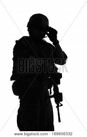 United states Marine Corps special operations command Marsoc raider with weapon. Silhouette of of Marine Special Operator white background