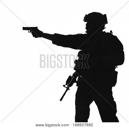 United states Marine Corps special operations command Marsoc raider with weapon aiming pistol. Silhouette of Marine Special Operator white background