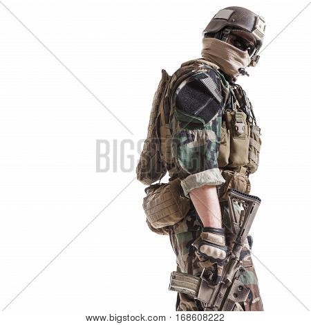 United states Marine Corps special operations command Marsoc raider with weapon. Studio shot of Marine Special Operator white background turning around