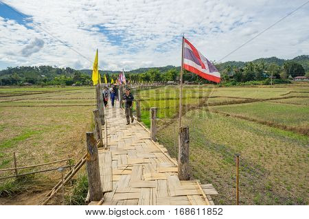 Mae Hong Son, Thailand - JAN 2, 2017: Many people walking on a bamboo bridge ( Su Tong Pe bridge) in Mae Hong Son province Thailand.
