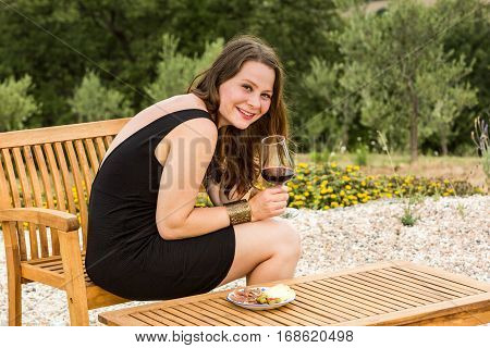 Girl With A Glas Of Wine At Sunset In Tuscany, Italy