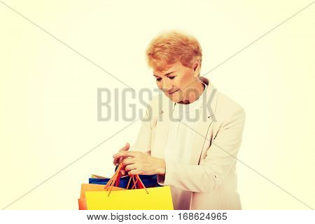 Happy business woman holging shopping bags