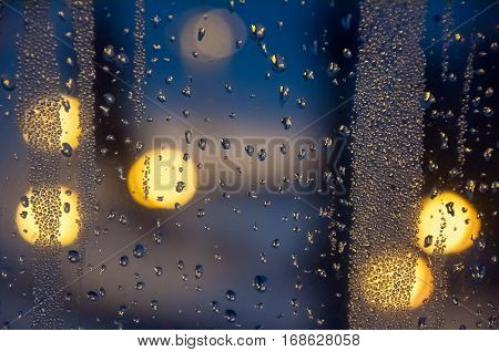 Condenced water drops on a blurred background with lights