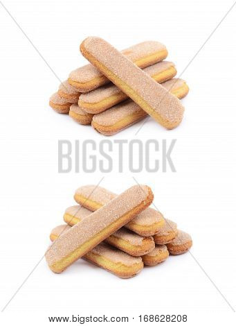 Pile of multiple ladyfinger savoiardi biscuit cookies, composition isolated over the white background, set of two different foreshortenings