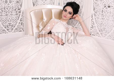 Gorgeous Bride With Dark Hair In Luxuious Wedding Dress