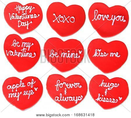 Home made Valentines day cookies with love quotes written in sugar frosting. 
