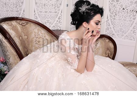 Gorgeous Bride With Dark Hair In Luxuious Wedding Dress
