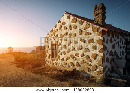 House on the cliff of the Atlantic Ocean coast in the Alentejo region of Portugal