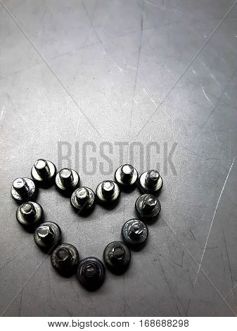 Industrial steel hardware bolt and nut on background