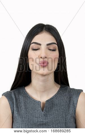 Close up of a young business woman kissing.
