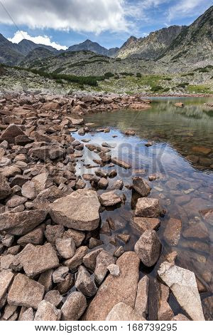 Clouds over Musala peak and reflection in Musalenski lakes,  Rila mountain, Bulgaria