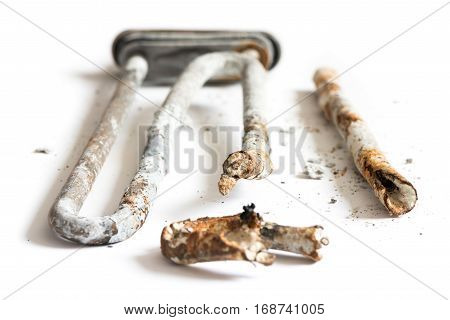 Damaged Heating Element of the Washing Machine on White Background.