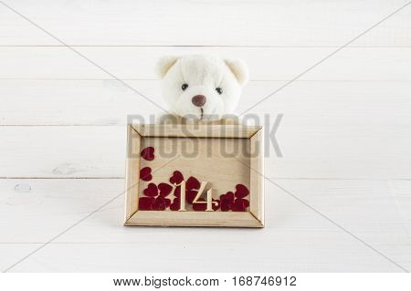 White Teddy Bear Holding Plate With Hearts. Concept On 14 February.