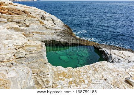 Green waters of Giola Natural Pool in Thassos island, East Macedonia and Thrace, Greece