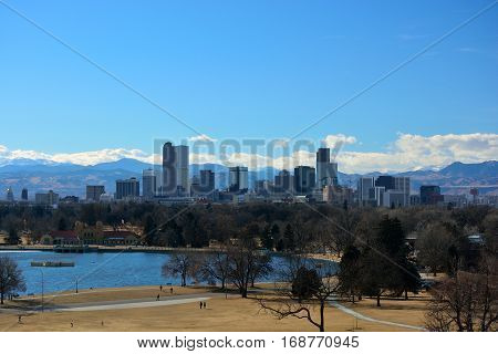 Downtown Denver Colorado Skyscrapers with the Rocky Mountains in the Background on a Sunny Winter Day