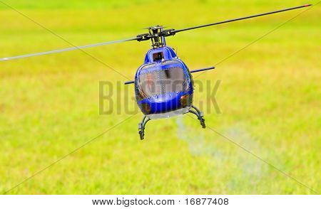 Flying helicopter (radio controled scale-model 1:24 scale) Teleobjective shot with shallow DOF.