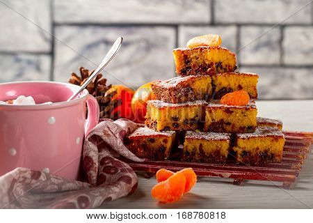 Pie with mandarines. Pie chocolate. Pink mug. Coffee. Grey background