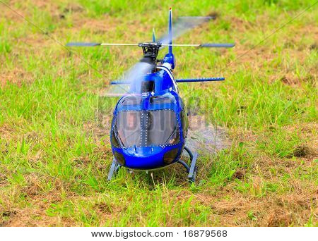 Flying helicopter (radio controlled scale-model 1:24 scale) Teleobjective shot with shallow DOF.