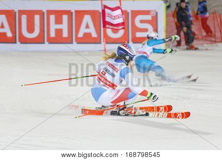 STOCKHOLM SWEDEN - JAN 31 2017: Side view of Melanie Meillard (SUI) and competiotor in the downhill skiing in the parallel slalom alpine event Audi FIS Ski World Cup. January 31 2017 Stockholm Sweden