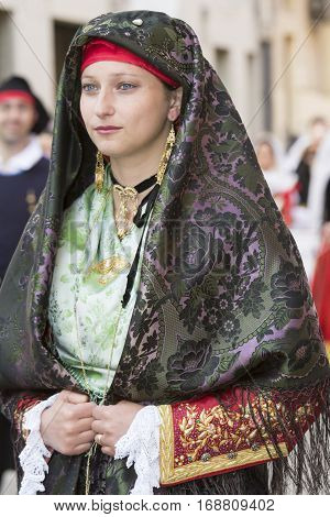 CAGLIARI, ITALY - May 1, 2014: 358 Religious Procession of Sant'Efisio - Sardinia - portrait of a beautiful girl in traditional Sardinian costume