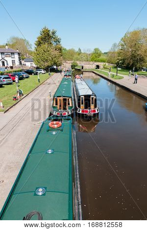 TREVOR WALES UNITED KINGDOM - MAY 16 2016: Narrowboats on the Llangollen canal a popular holiday getaway for families and tourists to enjoy the extensive inland waterway network