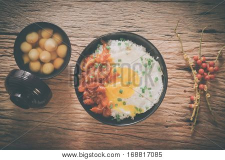 Rice With Fried Egg And Tomato Sauce On Table Vintage Wooden Surface Top View