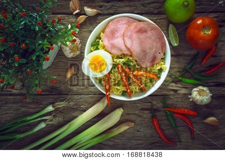Ramen Noodles With Vegetables Egg Ham On Old Rustic Wooden Background Vintage Style.