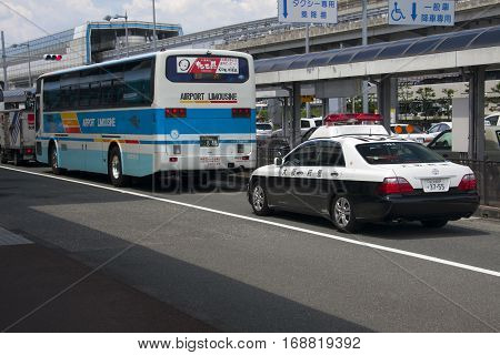 Osaka, Japan - Aug 10: Airport Limousine Bus And Police Car In Osaka International Airport Itami. Au